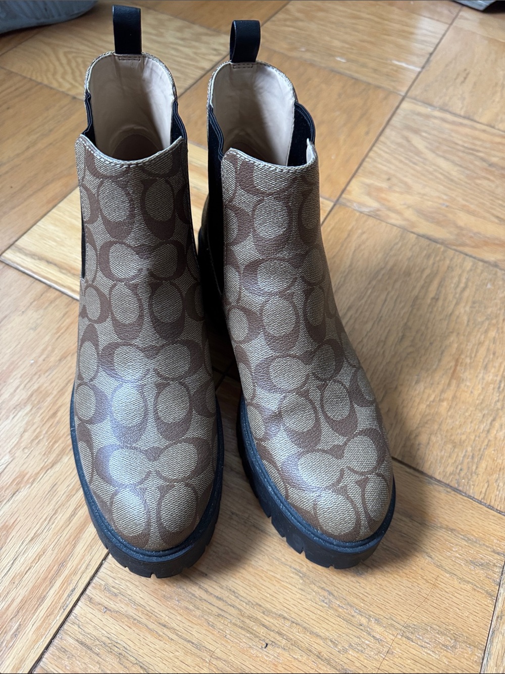 Coach Monogram Chelsea Lug Booties in Brown and Black